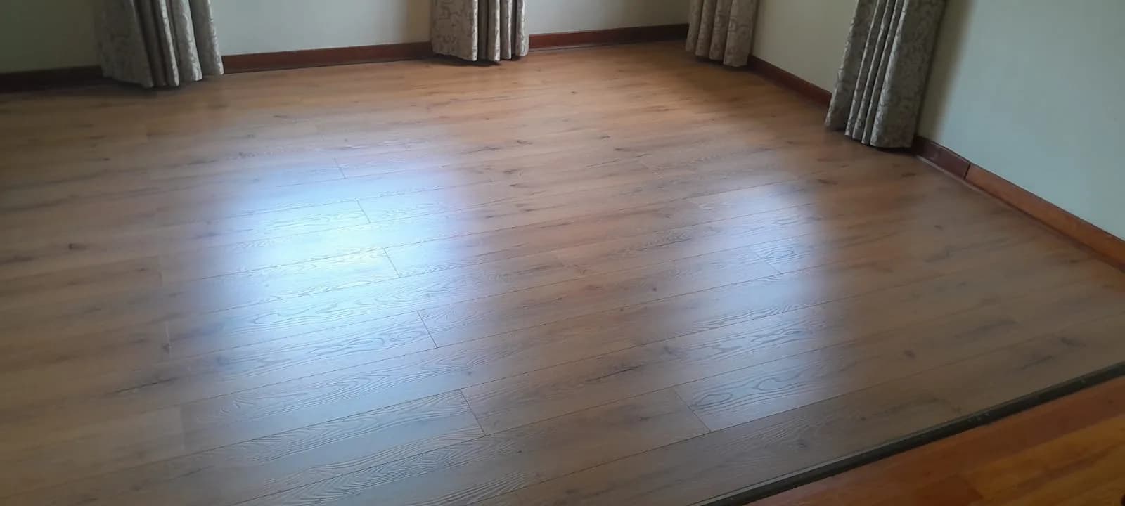 FINfloor laminate flooring fitted room to room